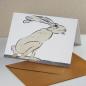 Preview: Hase legt ein goldenes Ei - Künstler-Osterkarte mit goldenem Umschlag
