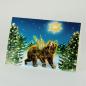 Preview: skurille Weihnachtskarte: Geflügelter Bär im Wald