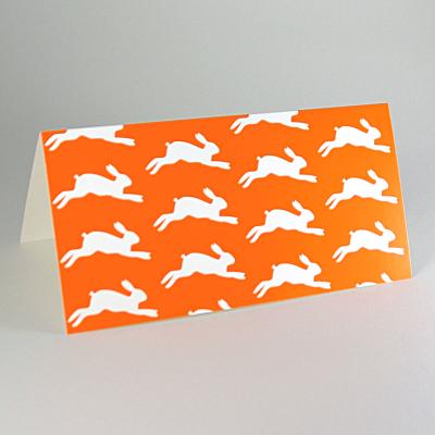 10 orange Osterkarten mit transparenten Kuverts: springende Hasen