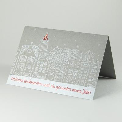 graue Weihnachtskarte mit weißem Druck: weihnachtliche Häuserzeile