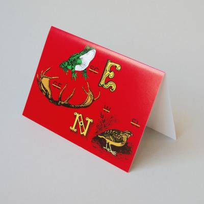 rote Weihnachtskarte mit Rebus (Bilderrätsel)