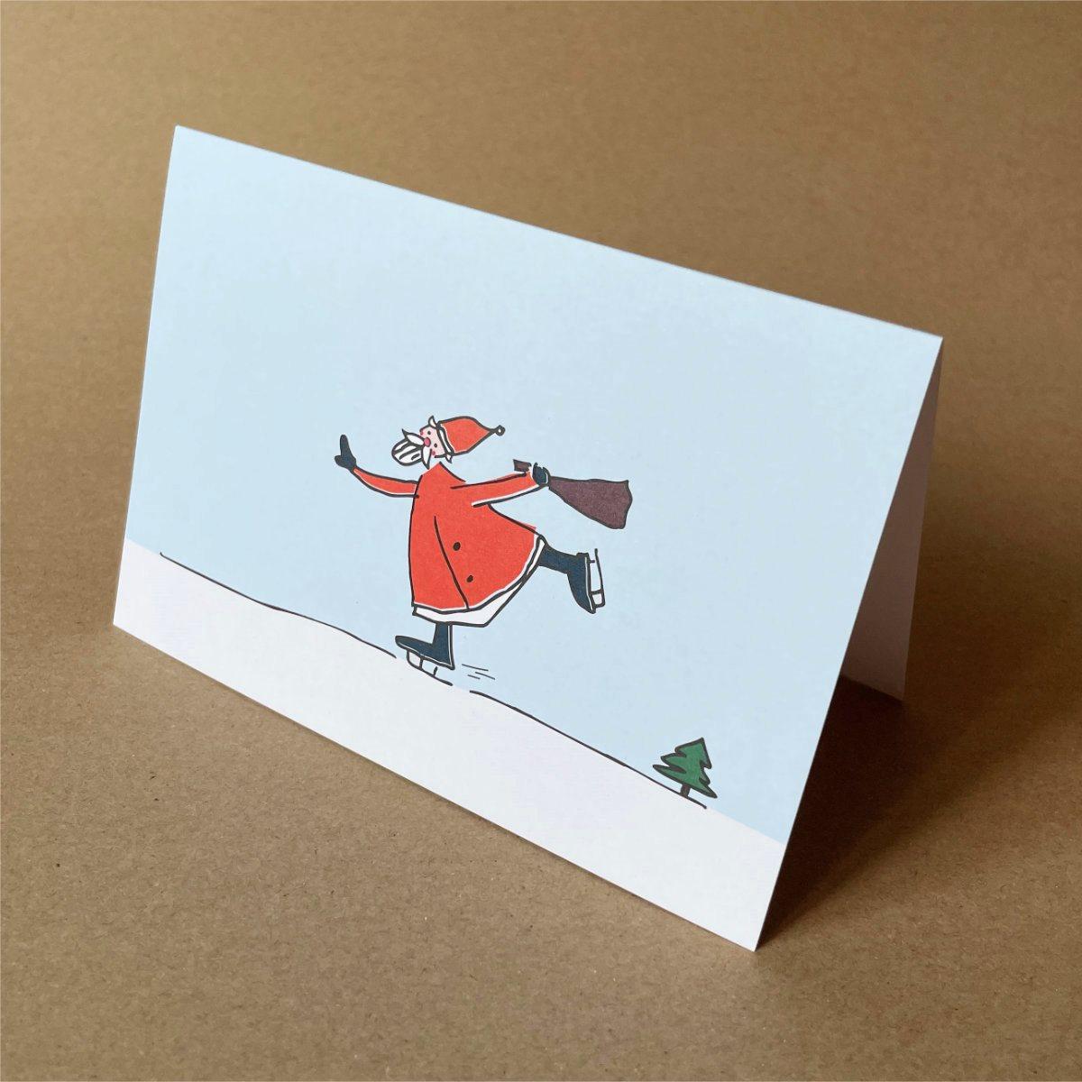 Weihnachtskarte: schlittschuhlaufender Weihnachtsmann