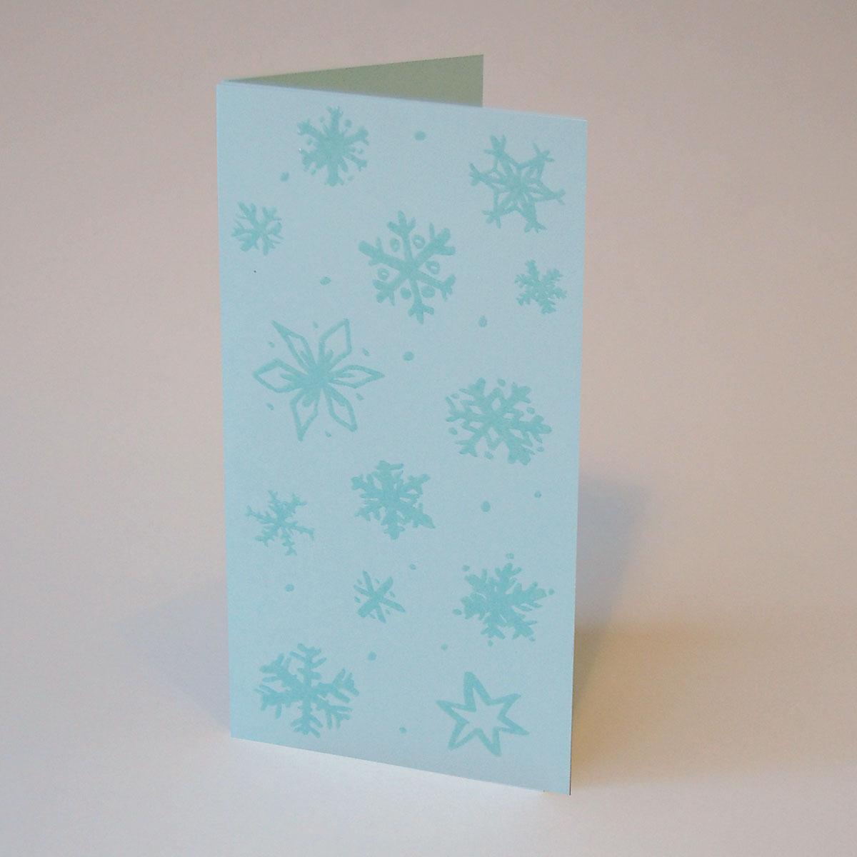 Weihnachtskarte: Schneeflocken (hellblauer Karton)