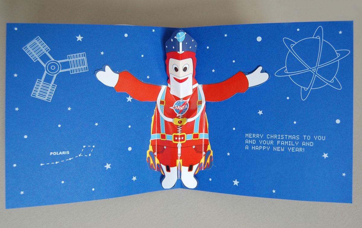 Weihnachtskarte: Kosmischer Pop-up-Weihnachtsmann